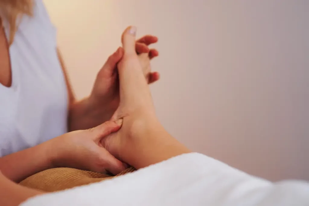 Reflexologist working on a patients foot